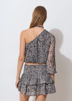 Blusa asimétrica brillo estampada