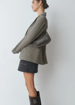 Bolso piel tachas